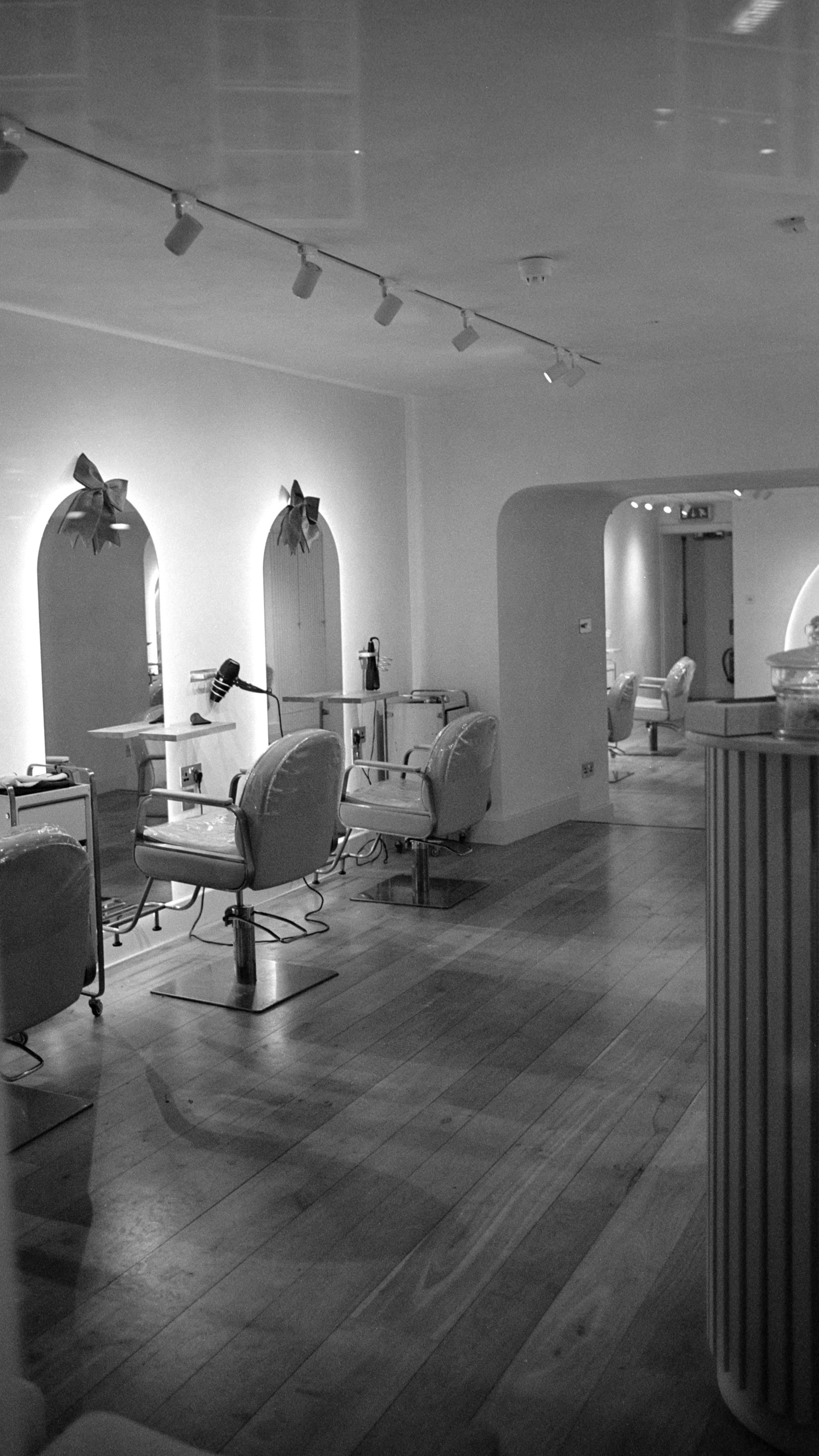 Salon styling stations, warm vanity lighting